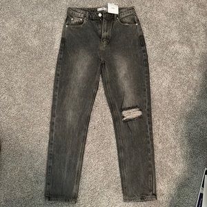 NWT! Adika light wash black denim jeans with knee rip!